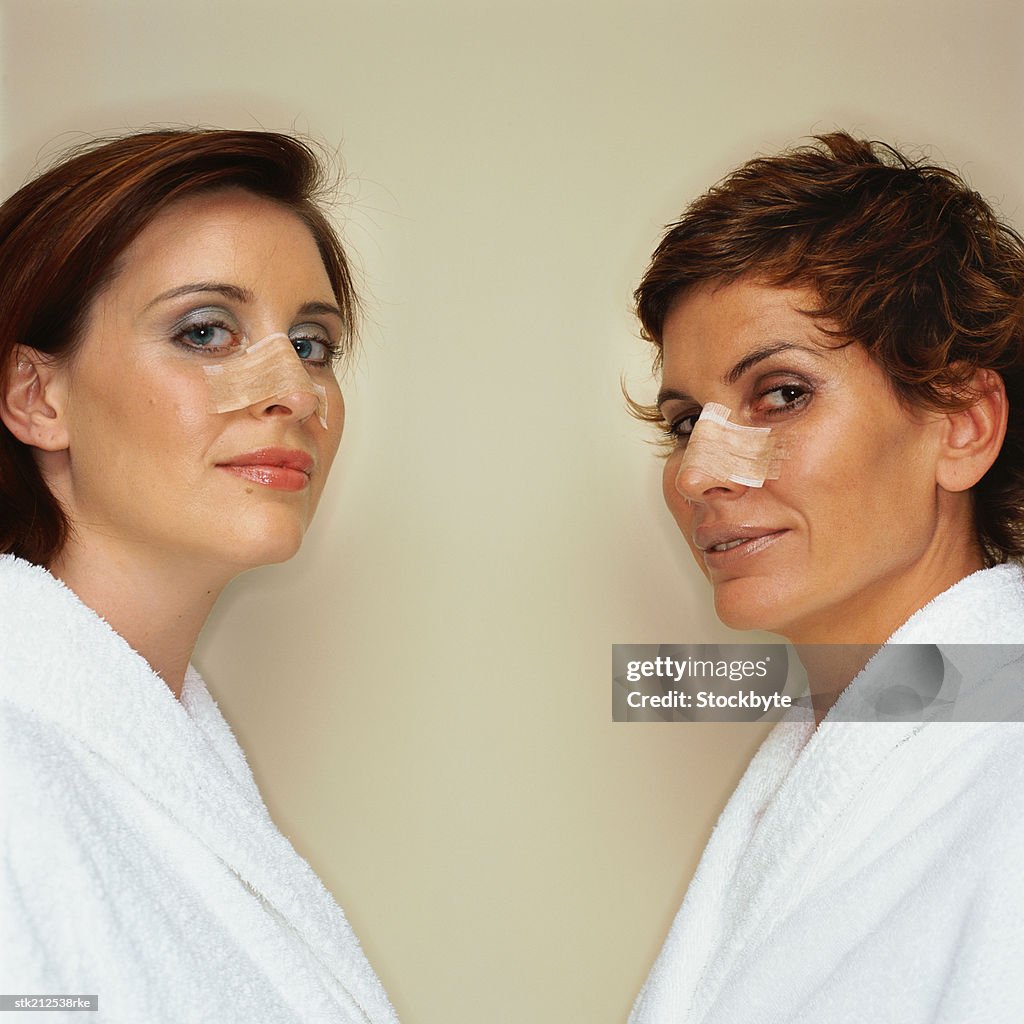 Portrait of two women with bandaged noses