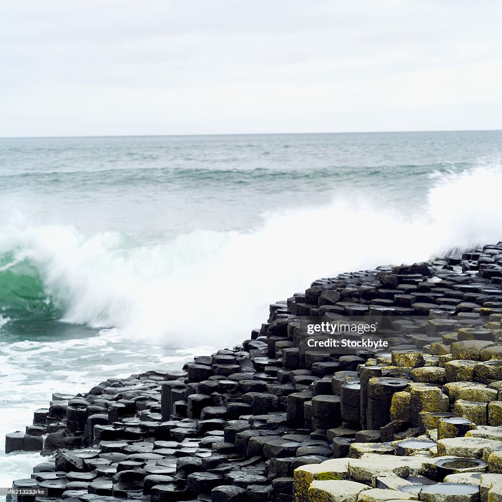 Two people standing on the Giants Causeway in County Antrim