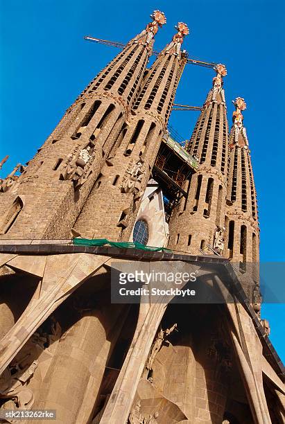front facade of the sangria familia church, barcelona, spain - familia stock pictures, royalty-free photos & images