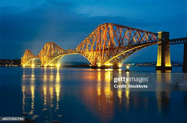 forth rail bridge illuminating queensferry, edinburgh, scotland - south queensferry ストックフォトと画像