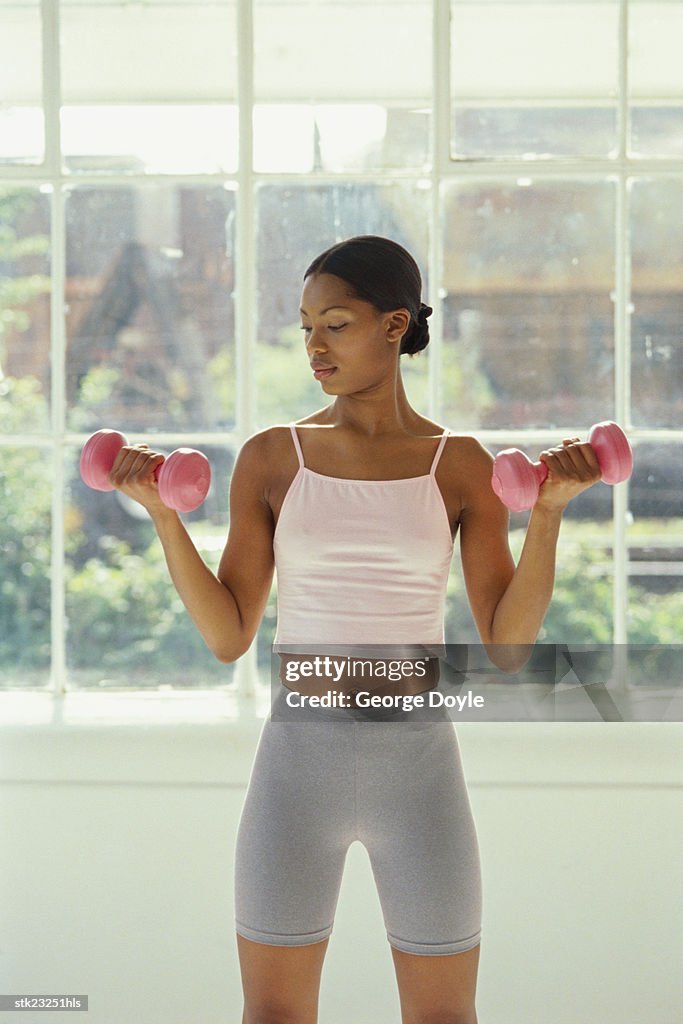 A woman exercising with dumbbells