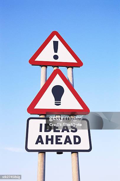 low angle view of a road sign saying ideas ahead - get ahead stock-fotos und bilder