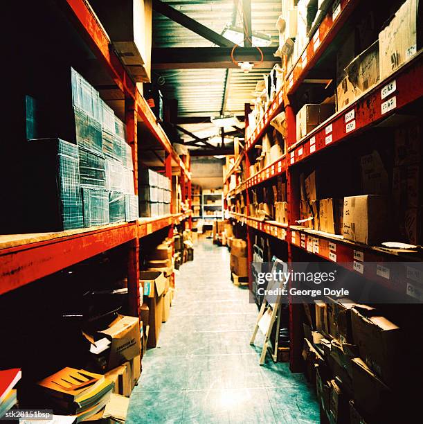 inside of a warehouse with shelves full of boxes - inside of ストックフォトと画像