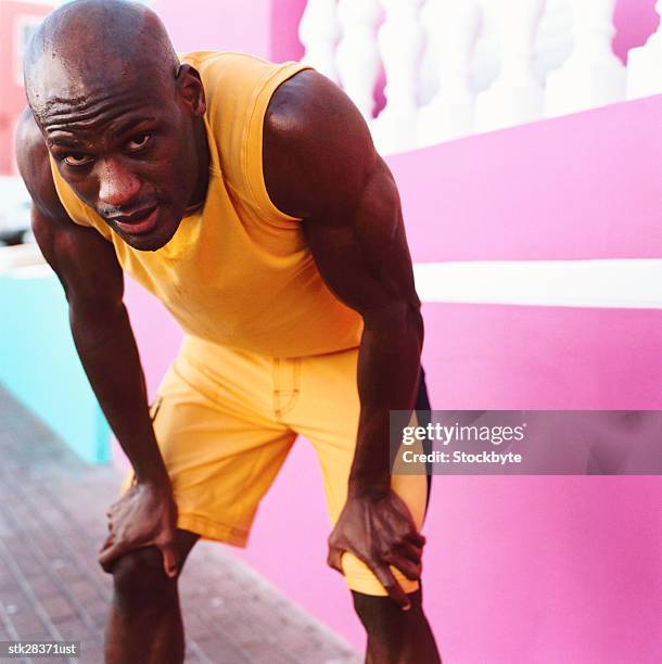 close-up of a man bending to rest after a workout - after stock pictures, royalty-free photos & images