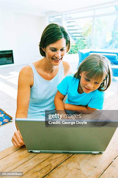 view of a mother and daughter (6-8) working on a laptop together - donald trump holds campaign rally in nc one day ahead of primary stockfoto's en -beelden