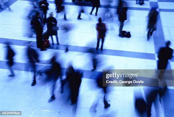 high angle view of people standing inside a building; blurred - inside of ストックフォトと画像