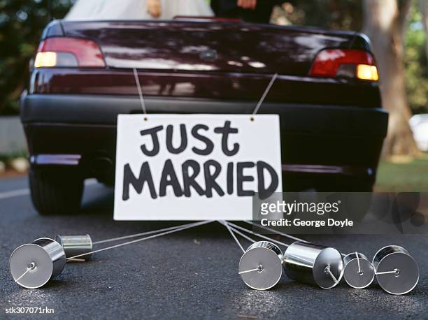 back of a car with a just married sign - just married car stock pictures, royalty-free photos & images
