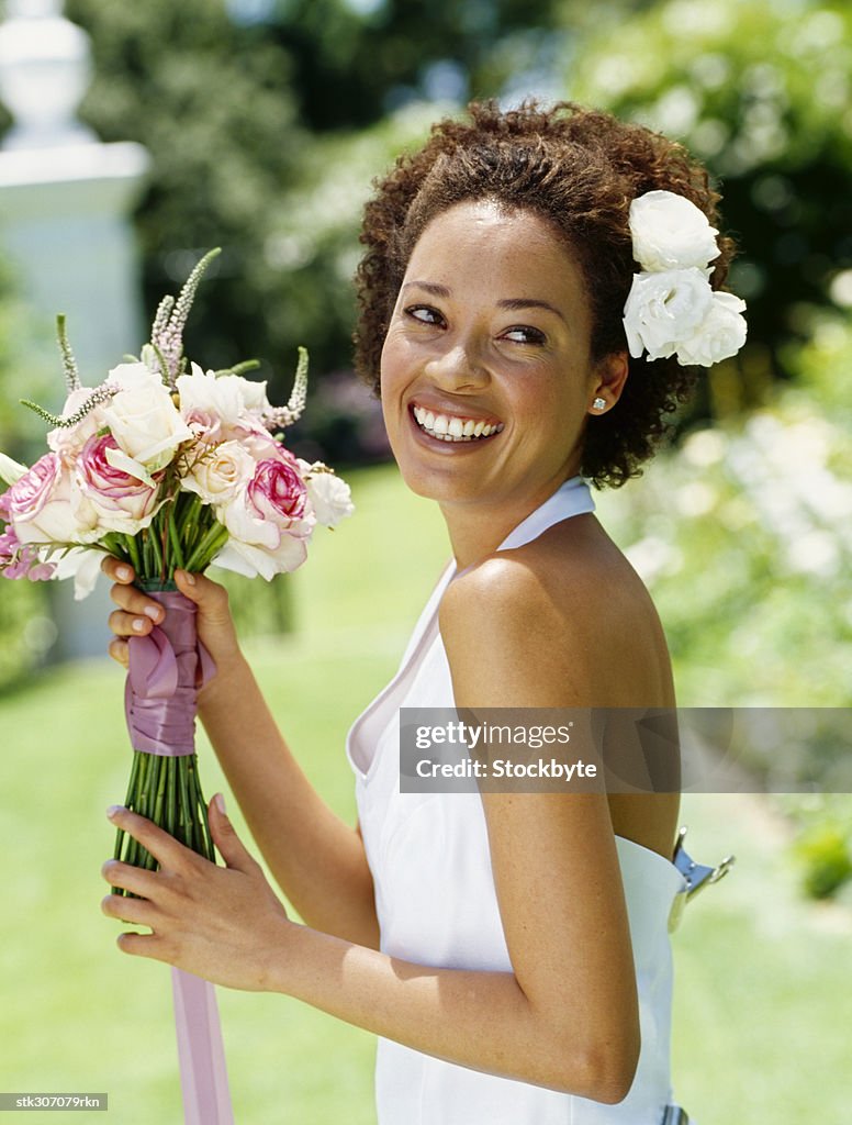 Side Profile Of A Young Woman Holding A Bouquet Of Flowers High-Res Stock  Photo - Getty Images