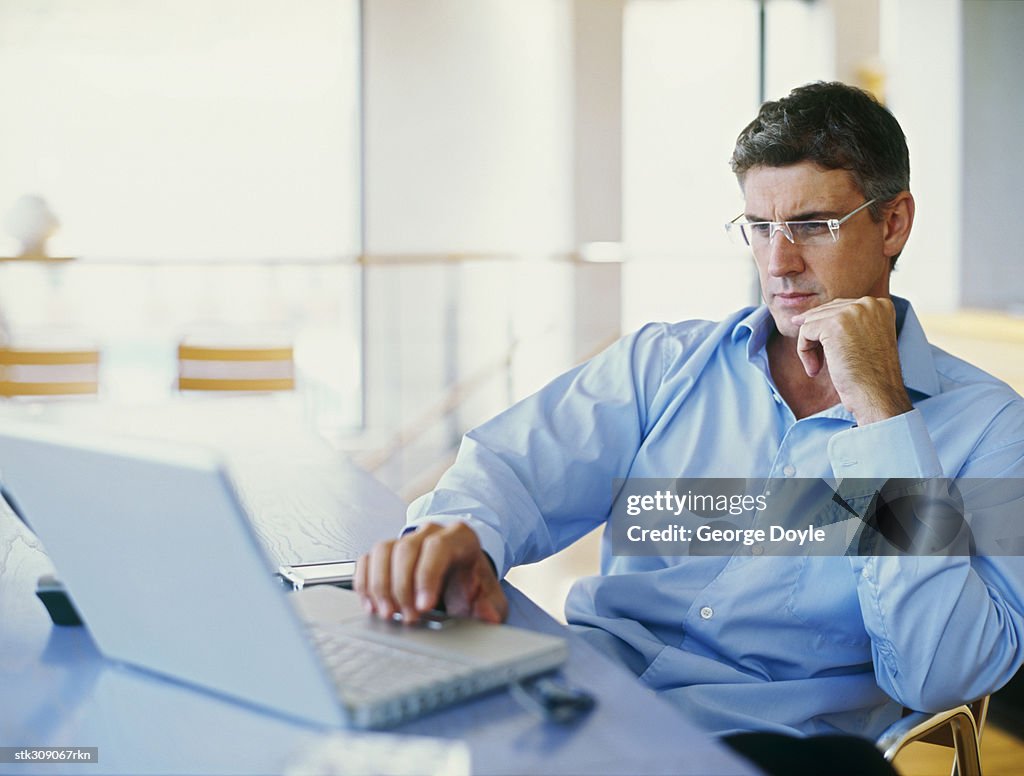 Businessman using a laptop in an office