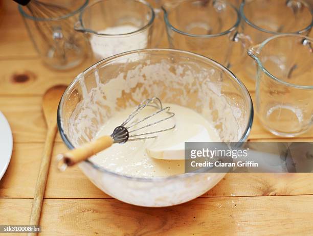 high angle view of a bowl with a wire whisk and a spatula - wire whisk ストックフォトと画像