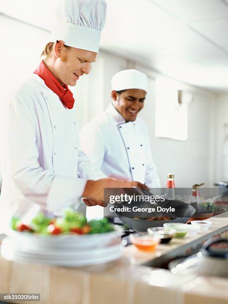 Chefs Stack Food Stack Of Frying Pans Photos and Premium High Res Pictures - Getty Images