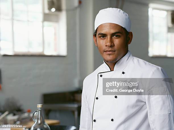 portrait of a chef standing in the kitchen - the kitchen bildbanksfoton och bilder