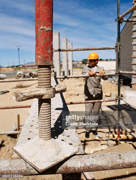 male architect standing at a construction site - swedish royals attend the royal swedish academy of engineering sciences formal gathering stockfoto's en -beelden