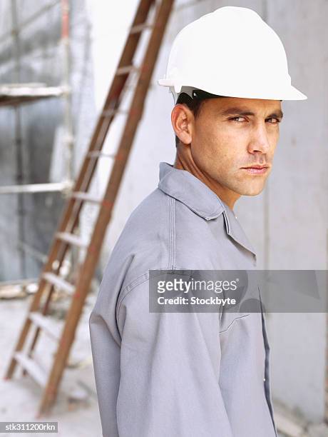 portrait of a male architect standing at a construction site - swedish royals attend the royal swedish academy of engineering sciences formal gathering stockfoto's en -beelden