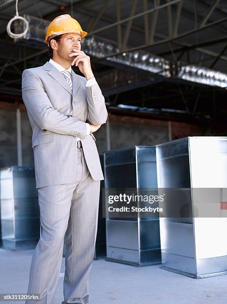 male architect thinking with his hand on his chin - swedish royals attend the royal swedish academy of engineering sciences formal gathering stockfoto's en -beelden