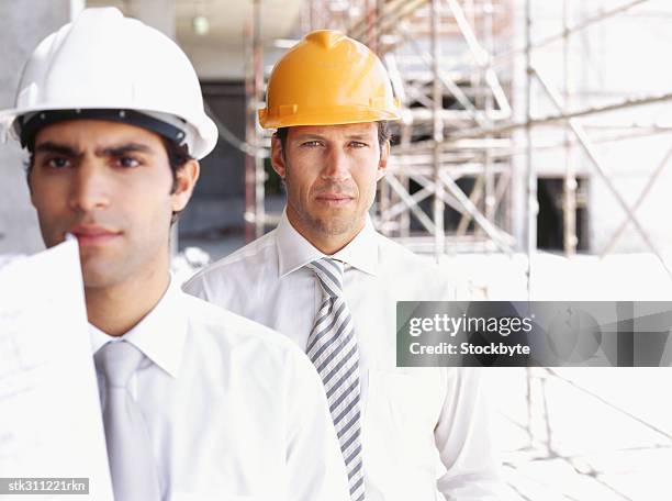 two male architects standing at a construction site - swedish royals attend the royal swedish academy of engineering sciences formal gathering stockfoto's en -beelden