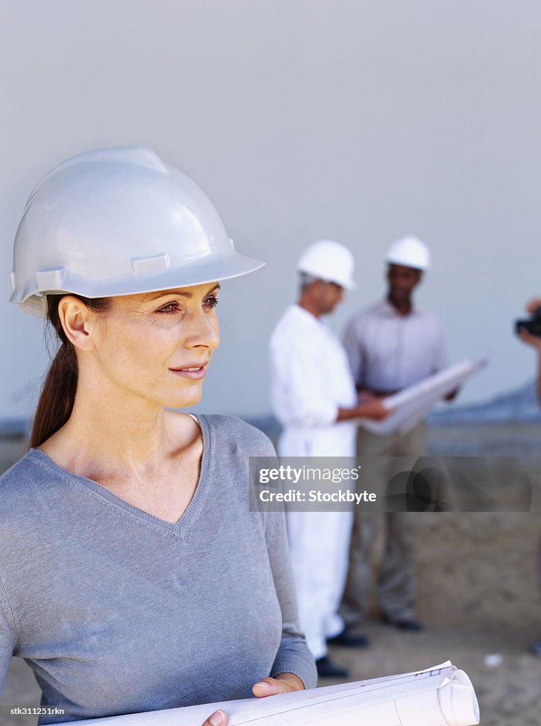 Female architect holding a blueprint