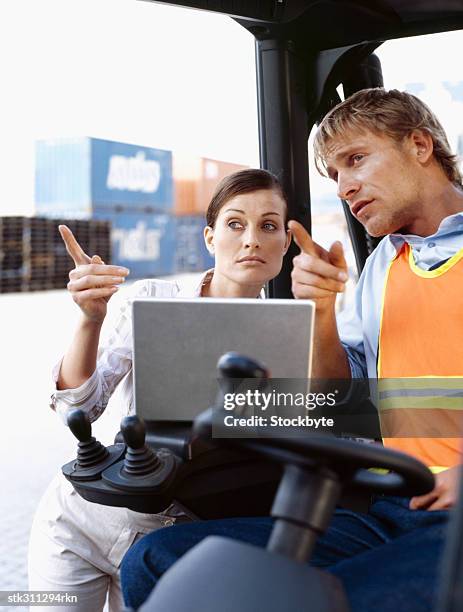 female engineer talking to a forklift operator - swedish royals attend the royal swedish academy of engineering sciences formal gathering stockfoto's en -beelden