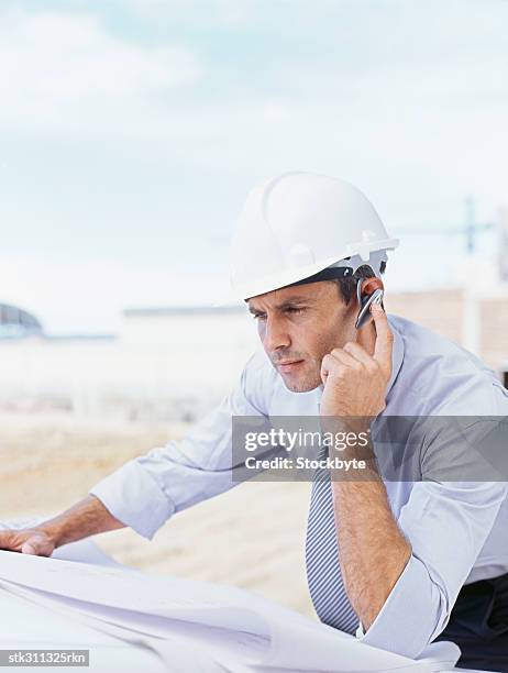 close-up of a male architect using a hands free device - gestalterischer beruf stock-fotos und bilder