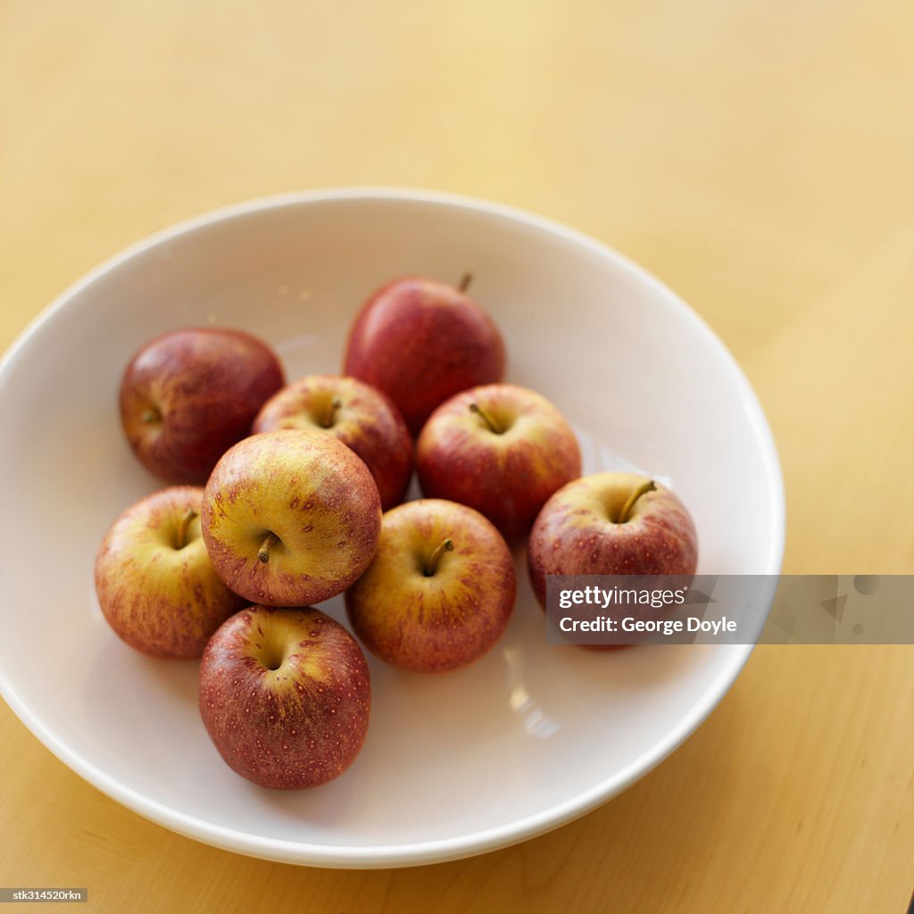 High angle view of apples in a fruit bowl on a table