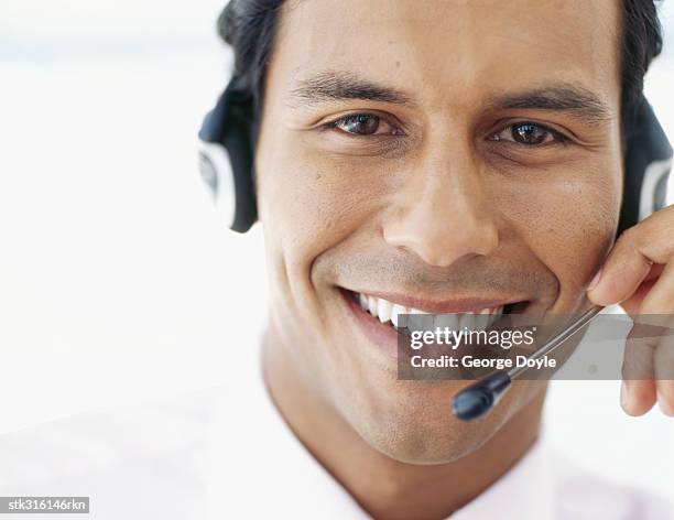 portrait of a businessman wearing a headset - communication occupation stock pictures, royalty-free photos & images