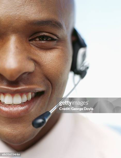 portrait of a businessman wearing a headset - communication occupation stock pictures, royalty-free photos & images