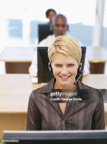 portrait of a businesswoman wearing a headset - communication occupation stock pictures, royalty-free photos & images