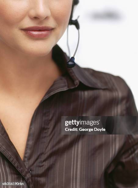 close-up of a businesswoman wearing a headset - communication occupation stock pictures, royalty-free photos & images