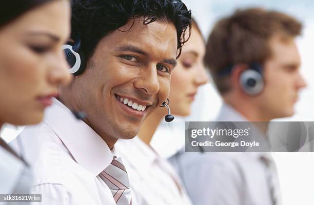 portrait of a businessman smiling - communication occupation stock pictures, royalty-free photos & images