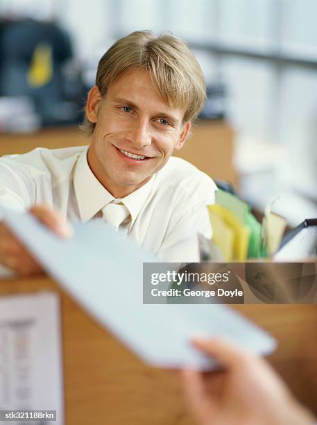Man Using File 67 Man Giving File Front View Stock Photos, High-Res Pictures, and ...