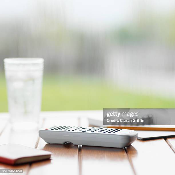 close-up of a remote control on a table - recreational equipment stock pictures, royalty-free photos & images