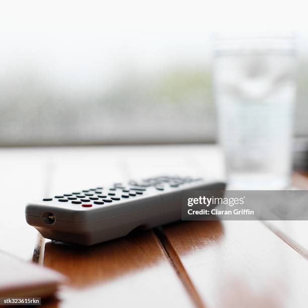 close-up of a remote control on a table - recreational equipment stock pictures, royalty-free photos & images