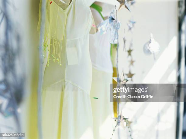 mannequin in a clothing store - stars of formula one and music make a noise at abbey road studios to help children locked away in orphanages stockfoto's en -beelden