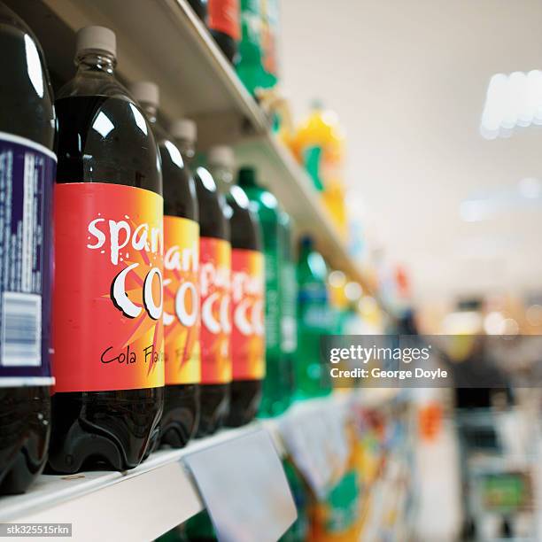 close-up of bottles arranged in a supermarket - unknown gender stock pictures, royalty-free photos & images