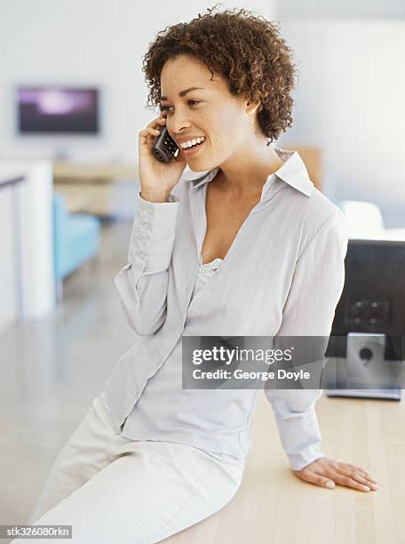 side profile of a mid adult woman talking on a mobile phone - curly hair profile stock pictures, royalty-free photos & images