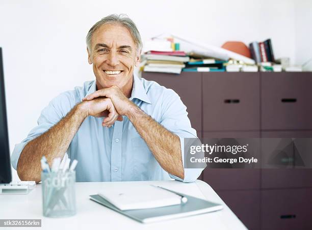 portrait of a mature man - writing instrument stock pictures, royalty-free photos & images