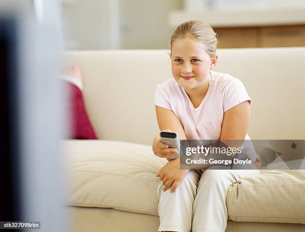 girl watching television - recreational equipment stock pictures, royalty-free photos & images