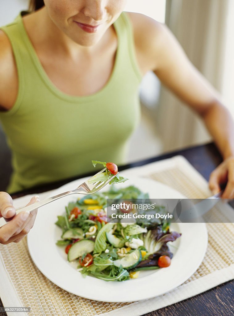 High angle view of a young woman having breakfast