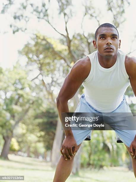 young man exercising in a park - adrienne bailon and gillette ask miami couples to kiss tell if they prefer stubble or smooth shaven stock pictures, royalty-free photos & images