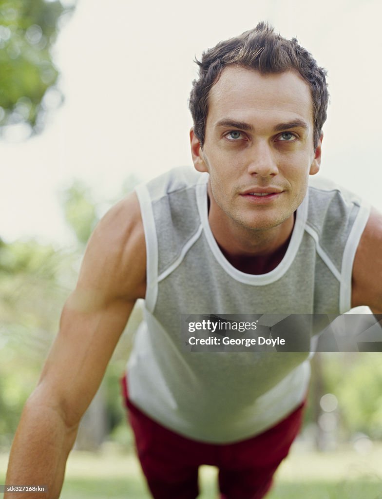 Young man exercising in a park