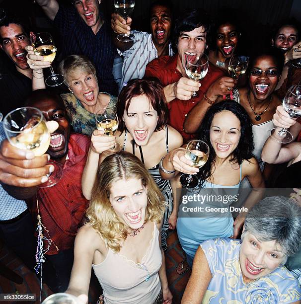 high angle view of party guests holding up their champagne glasses - style musical photos et images de collection