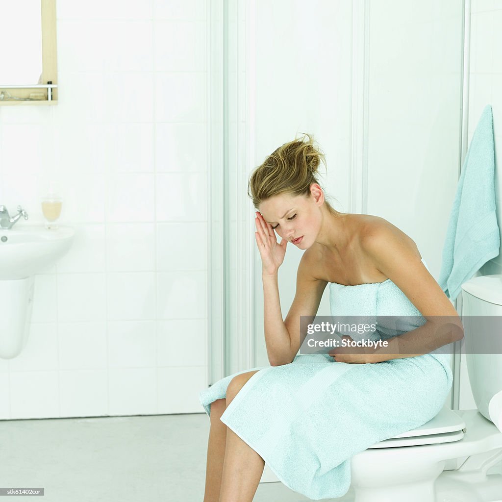 An ill woman in the bathroom