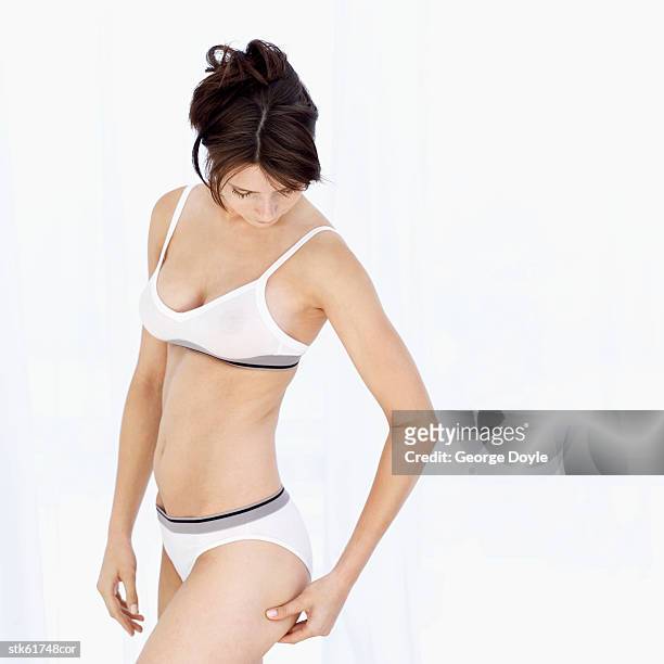 side profile of a woman doing a pinch-test - duing stock pictures, royalty-free photos & images