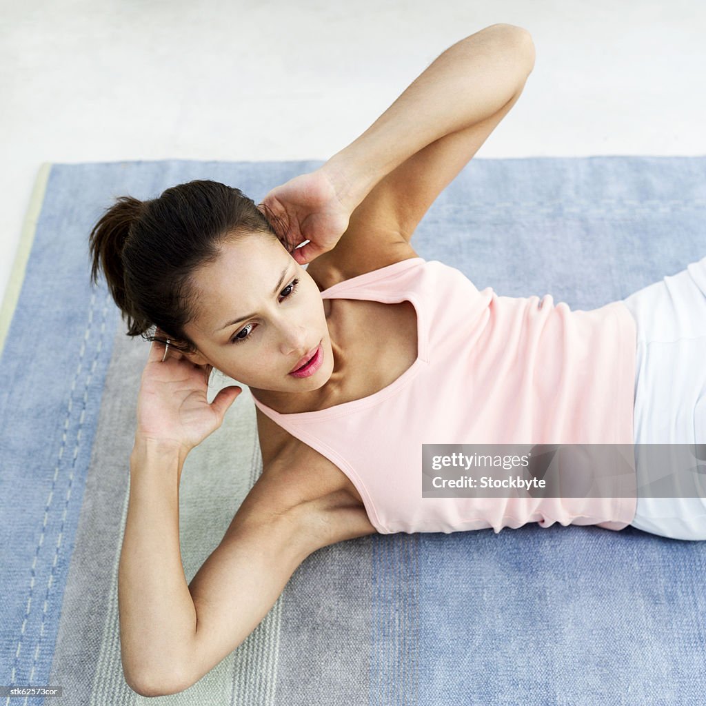 Portrait of a young woman exercising