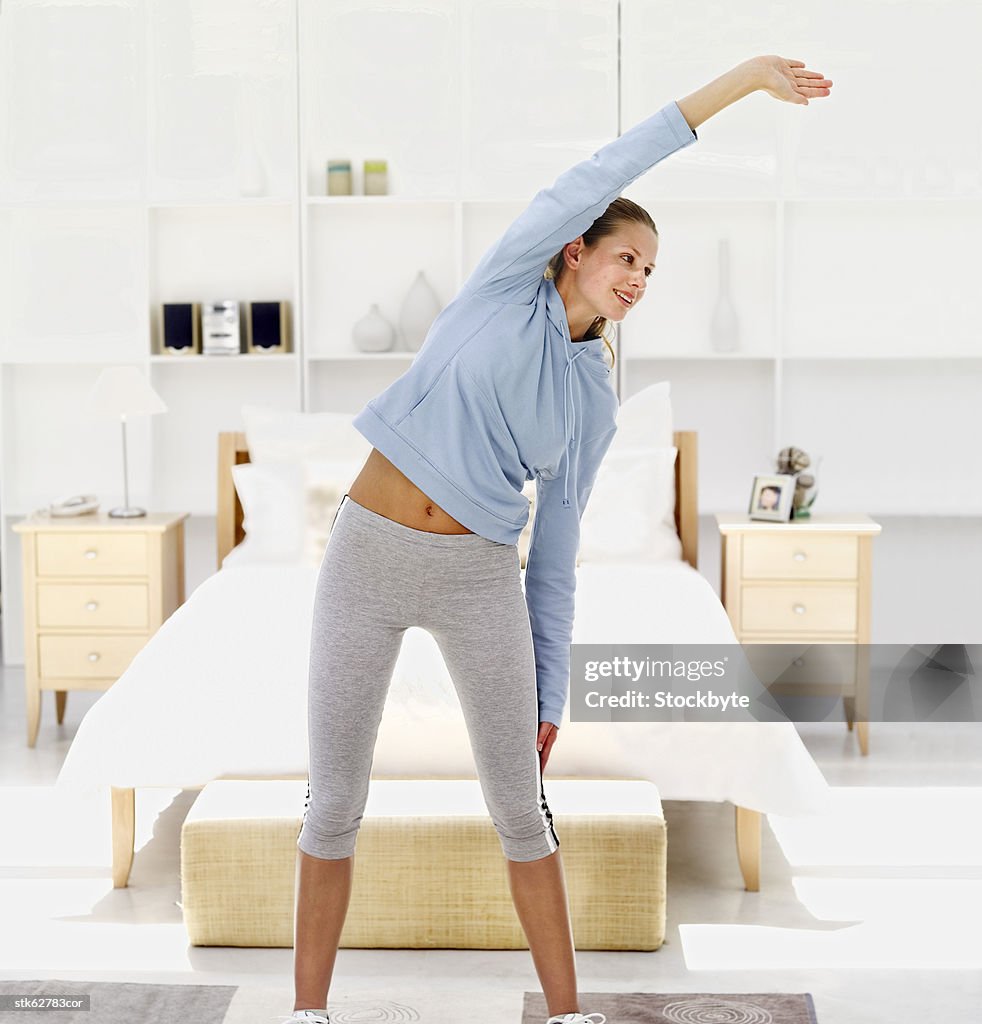 Portrait of a young woman exercising