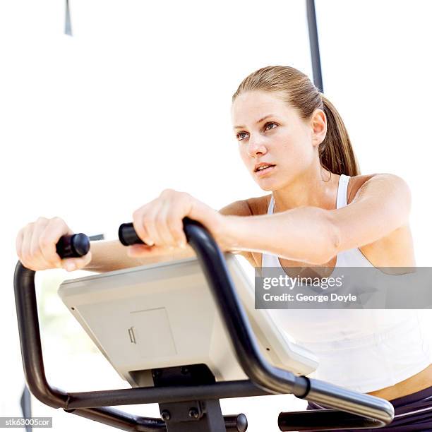 young woman working out at the gymnasium - get out stock pictures, royalty-free photos & images