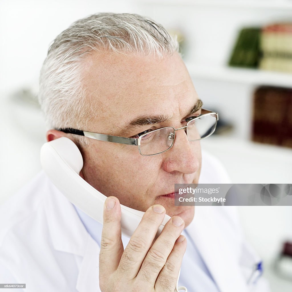 Close-up of an elderly man talking on the phone