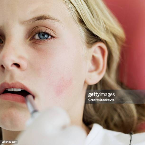 close-up of a girl (12-13) with suction tube in mouth - suction tube fotografías e imágenes de stock