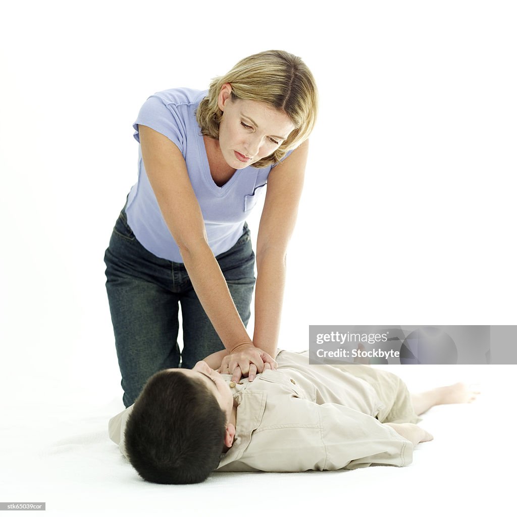 Portrait Of A Woman Resuscitating A Young Boy Stock Foto Getty Images portrait-of-a-woman-resuscitating-a-young-boy-stock-foto-getty-images