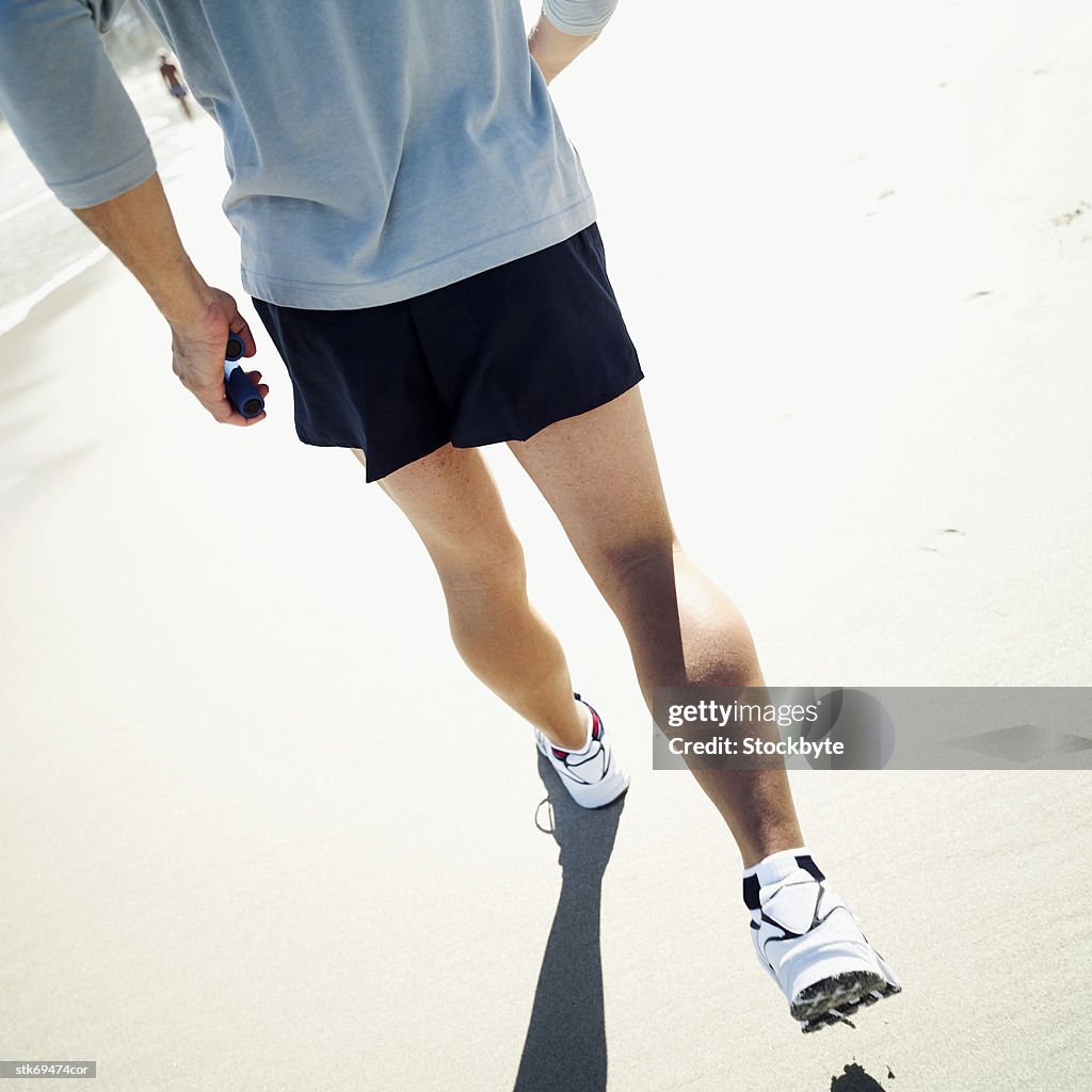 Man jogging at sea shore